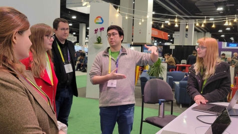 Argonne researchers Hannah Parraga (far right), Michael Prince (second from right) and Nicholas Schwarz (third from right) lead a demo at the SC23 conference on using integrated computing resources to accelerate discoveries at the Advanced Photon Source. (Image by Argonne National Laboratory)