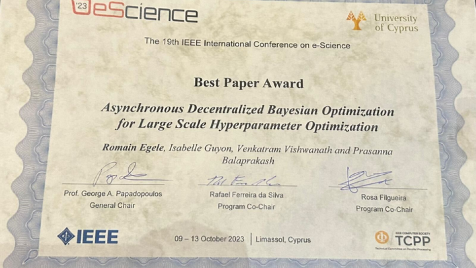 Image of IEEE eScience Best Paper Award received by science team comprising ALCF and OLCF staff.