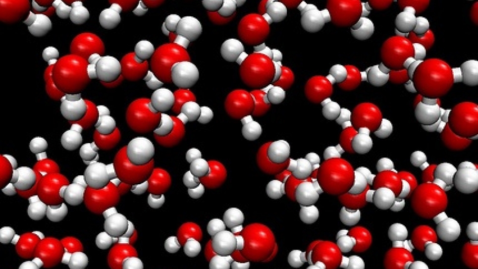 Snapshot of an ab-initio molecular dynamics simulation of water confined between a hydrogenated diamond slab.